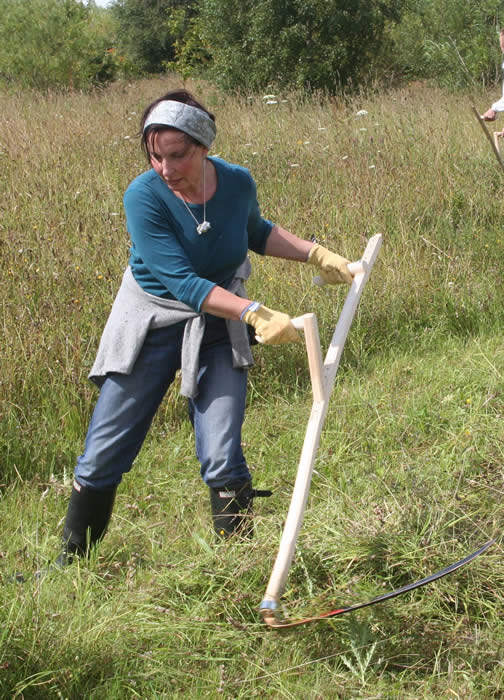 young woman scything